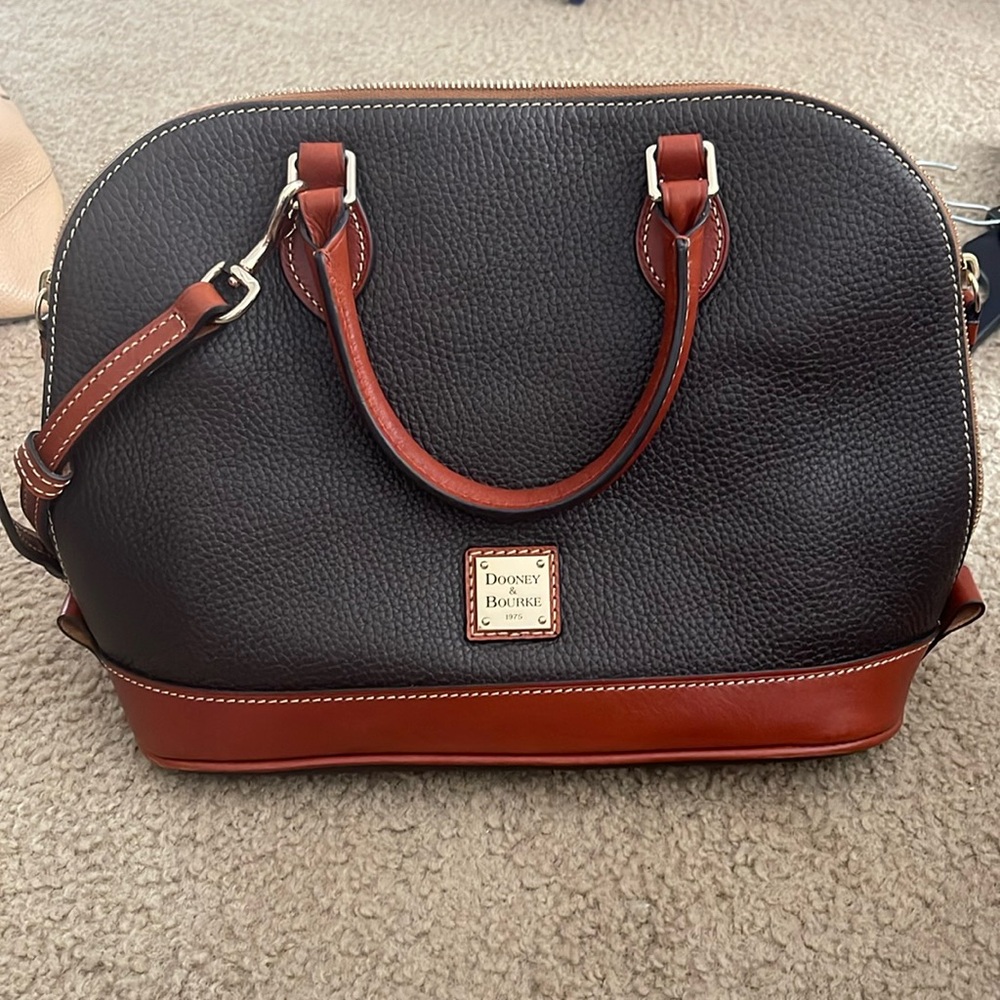 Dooney and Bourke never used ZipZip